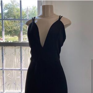 Black dressy romper by Charlotte Russe . Sz L.